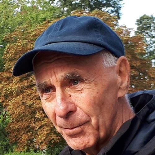 Paul Morrison wearing a navy baseball cap.